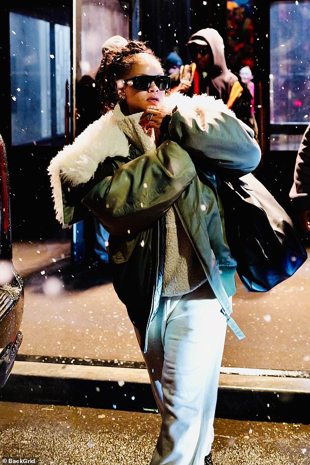 Rihanna shielded her eyes behind oversized shades and toted her essentials in an oversized leather shoulder bag