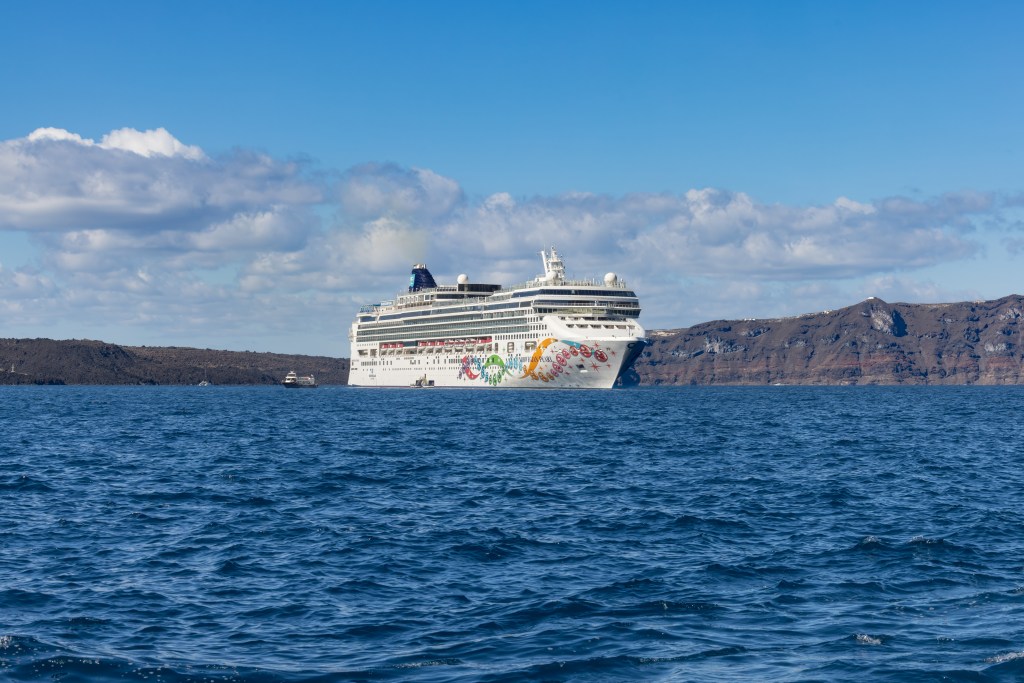 Norwegian Cruise Line ship Norwegian Epic anchored in the caldera of Santorini, Greece.