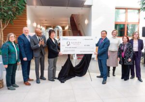 Queens College, in partnership with the Queens Chamber of Commerce Foundation, held a press conference on Thursday, February 5, to announce a scholarship hon­oring former Queens Borough President Claire Shulman (1926–2020). The scholar­ship will support undergraduate and graduate students in the college’s Urban Studies Department through cost of education awards and internships. (L. to r.): Queens Chamber of Commerce Foundation President Marian Conway; Queens Chamber of Commerce President and CEO Thomas Grech; Queens Borough Pres­ident Donovan Richards Jr; Shulman’s daughter, U.S. Astronaut Emerita Ellen Baker; Queens College President Frank H. Wu; Queens College Urban Studies De­partment Chair Melissa Checker; Queens Chamber of Commerce Foundation Board Member Eileen Auld; and Queens District Attorney Melinda Katz.