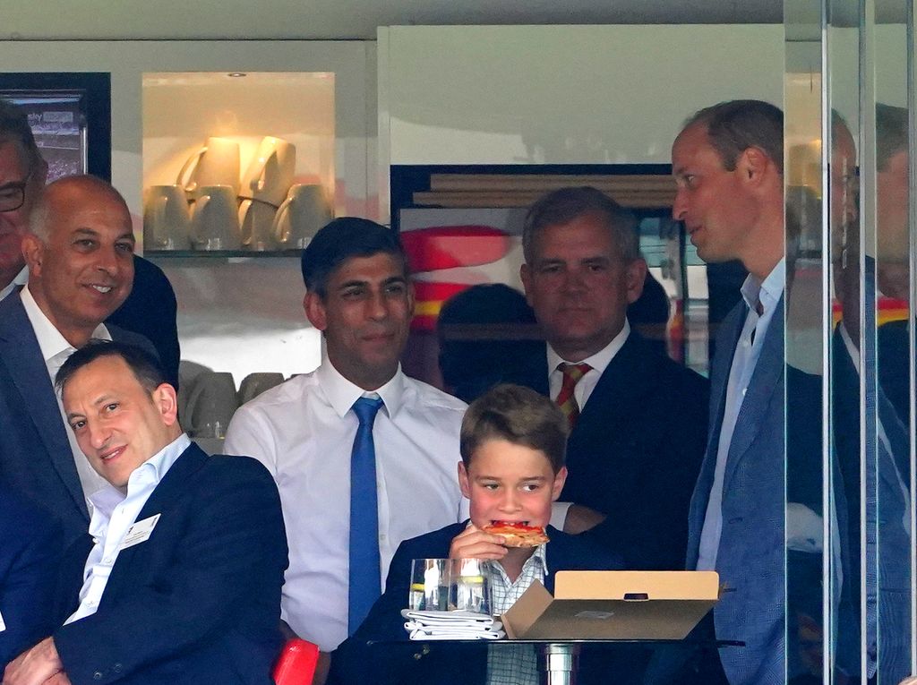 Prince George eats pizza during day four of the second Ashes test match at Lord's, London