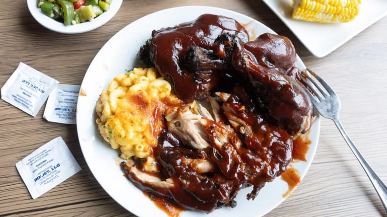 The BBQ chicken dinner with sauteed okra, candied yams, and...