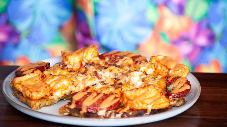 Dominican pizza at Caista RD in Baldwin includes green plantain...