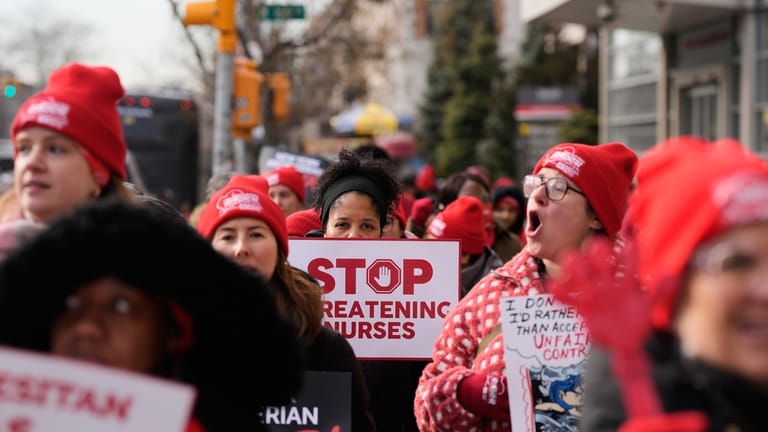 Striking nurses and supporters demonstrate outside NewYork-Presbyterian Hospital in New...