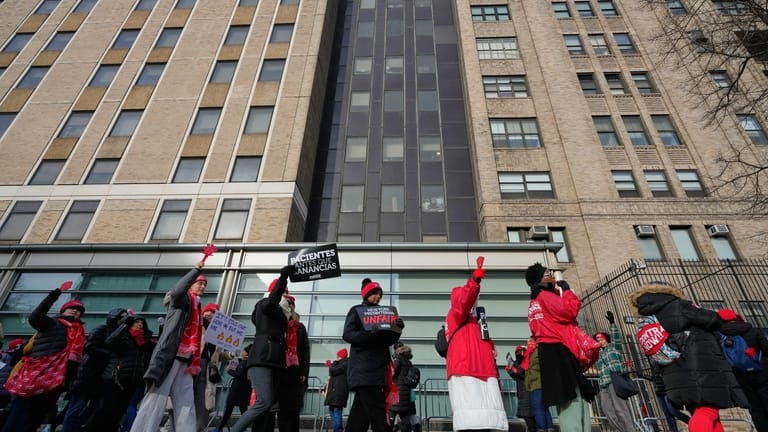 Striking nurses and supporters demonstrate outside NewYork-Presbyterian Hospital in New...
