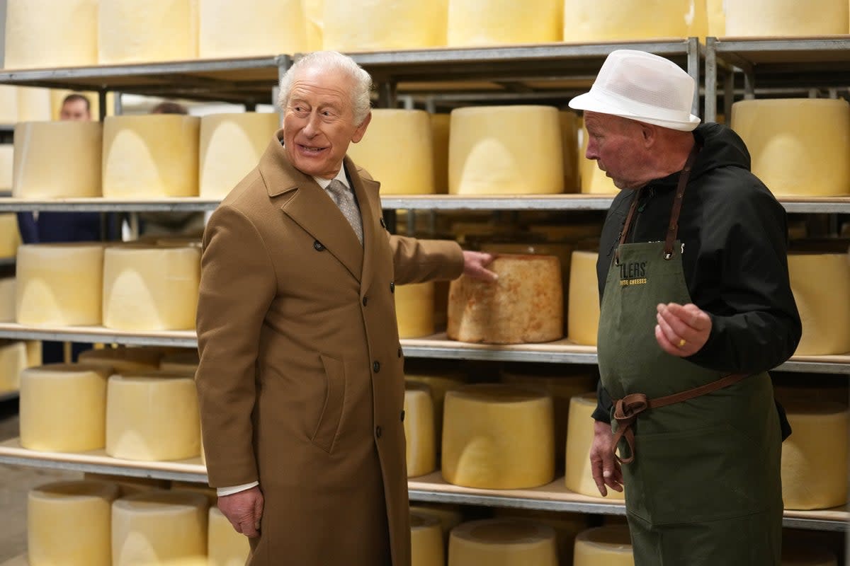 Charles speaks to cheese grader Bill Yates during his visit to Butlers Farmhouse Cheeses