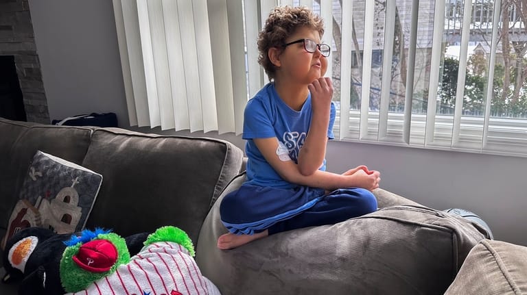 Logan Coyle, 9 years old, sits for a photo at...