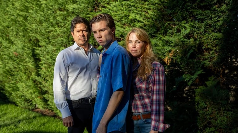 Orion Newby and his parents, Candace and Hunter Newby.