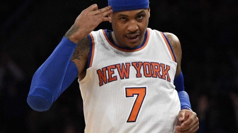 New York Knicks forward Carmelo Anthony reacts after sinking a...