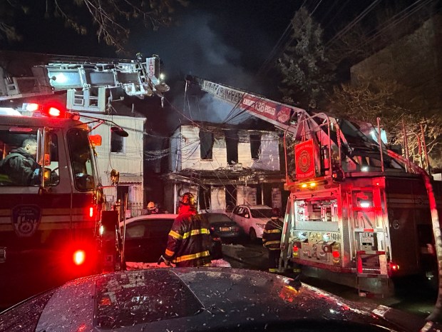 The scene of a four-alarm fire in Elmhurst, Queens that gutted two buildings on Dongan Ave. on Feb. 9, 2026. (Kerry Burke / New York Daily News) 