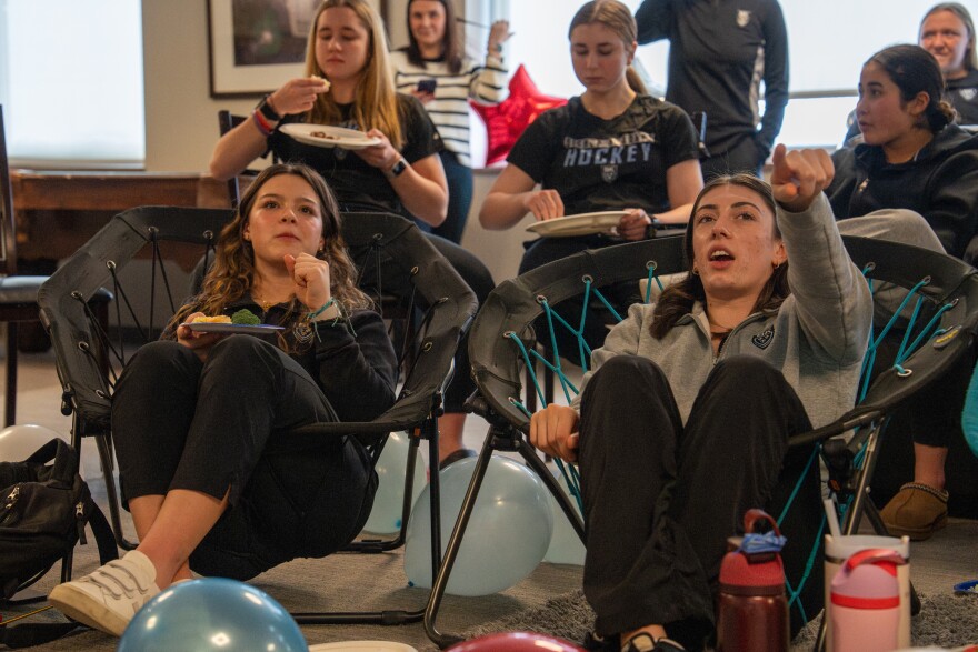Addison Tremel and Erin Healy watch the United States vs. Canada women’s Olympic hockey match with their teammates on Tue, Feb 10, 2026 at Bishop Kearney High School in Irondequoit.