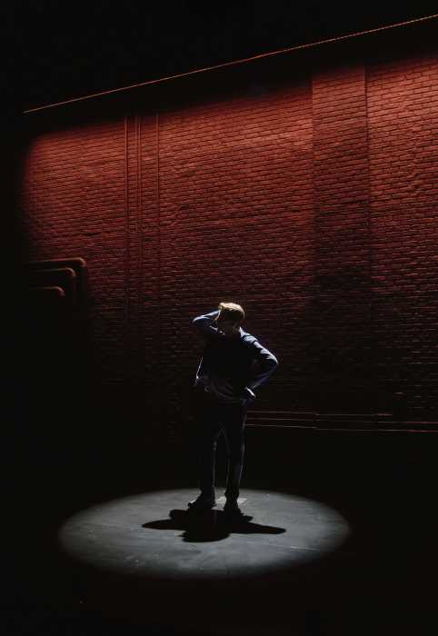 a spotlight on an actor on stage