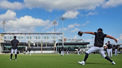 New York Yankees pitchers throw as they train at George...