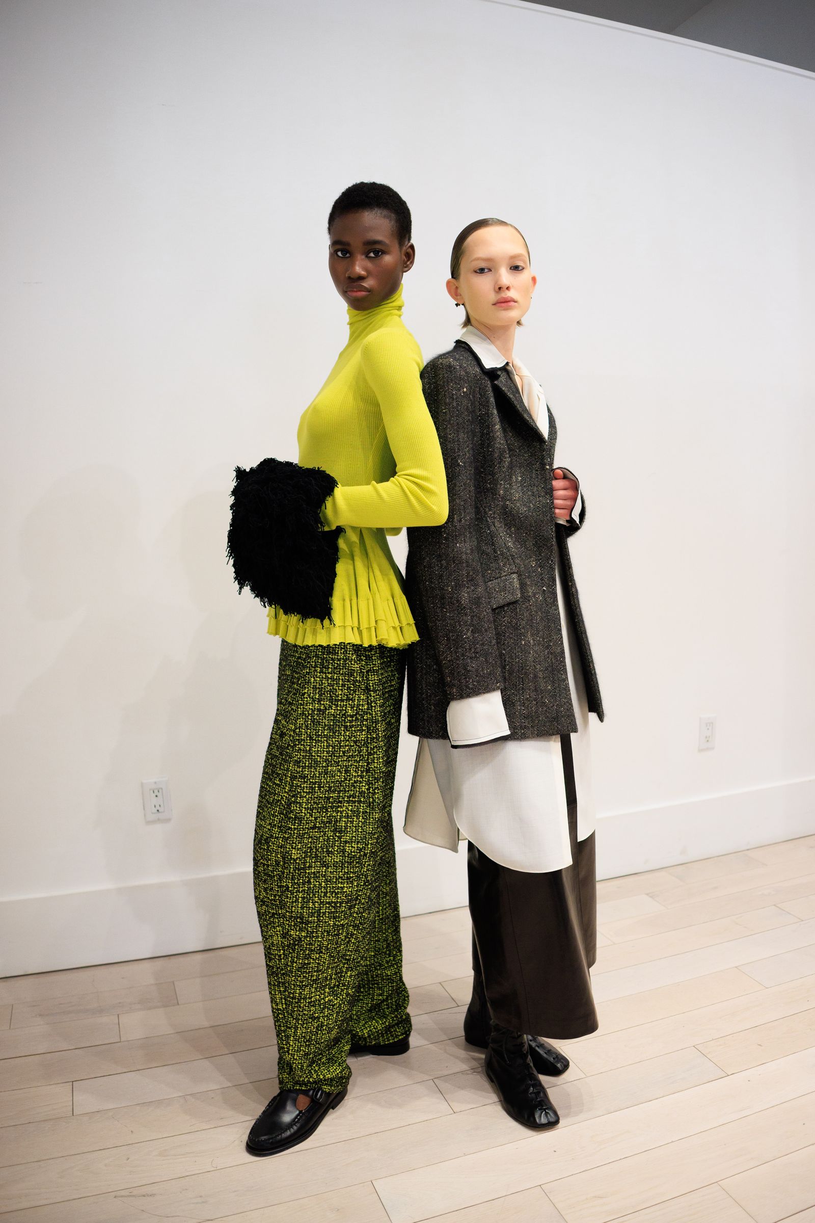 Image may contain Accessories Bag Handbag Clothing Coat Adult Person Long Sleeve Sleeve Blazer Jacket and Wedding