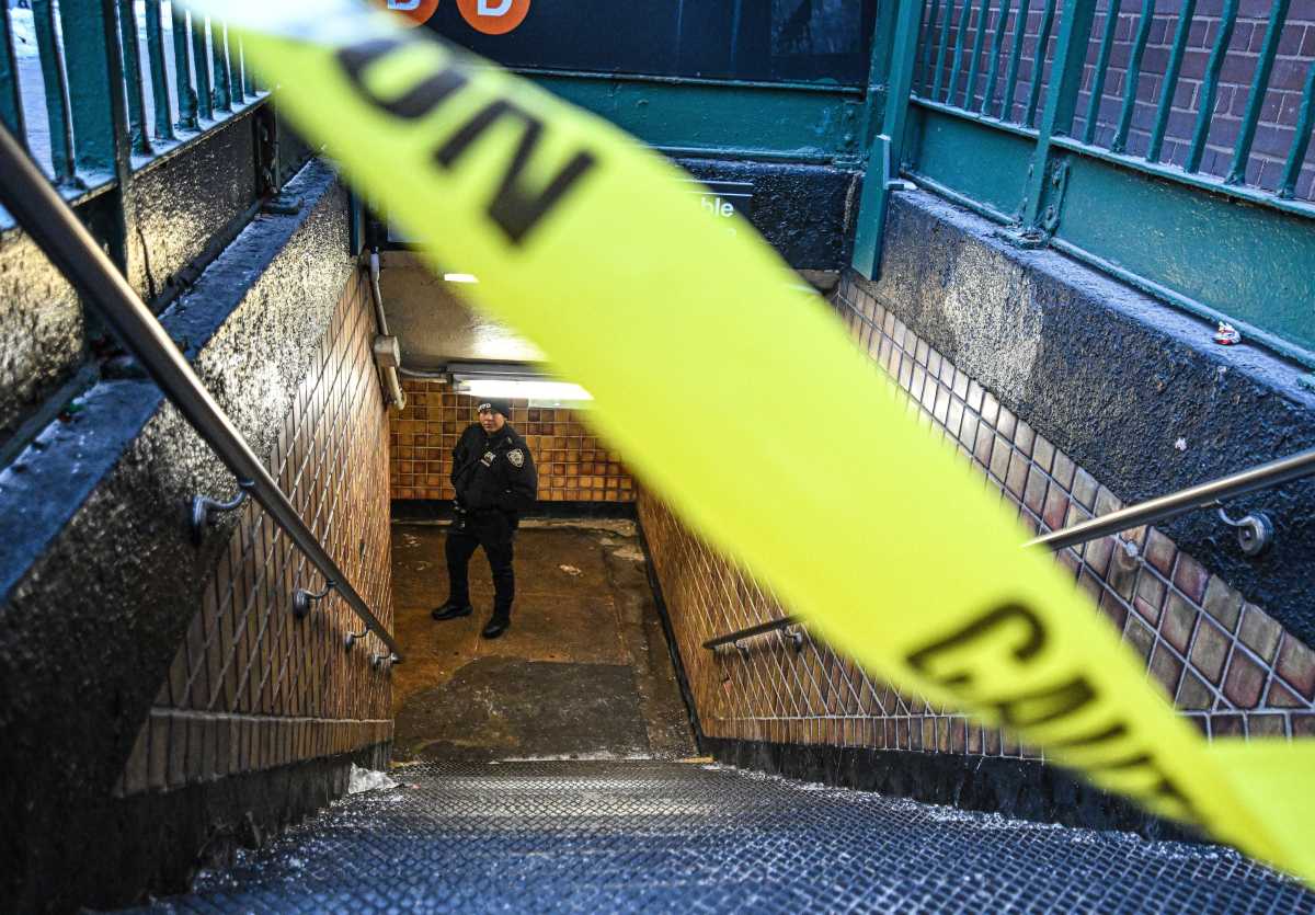 An officer at the scene of a shooting at the 170th Street B/D subway station.