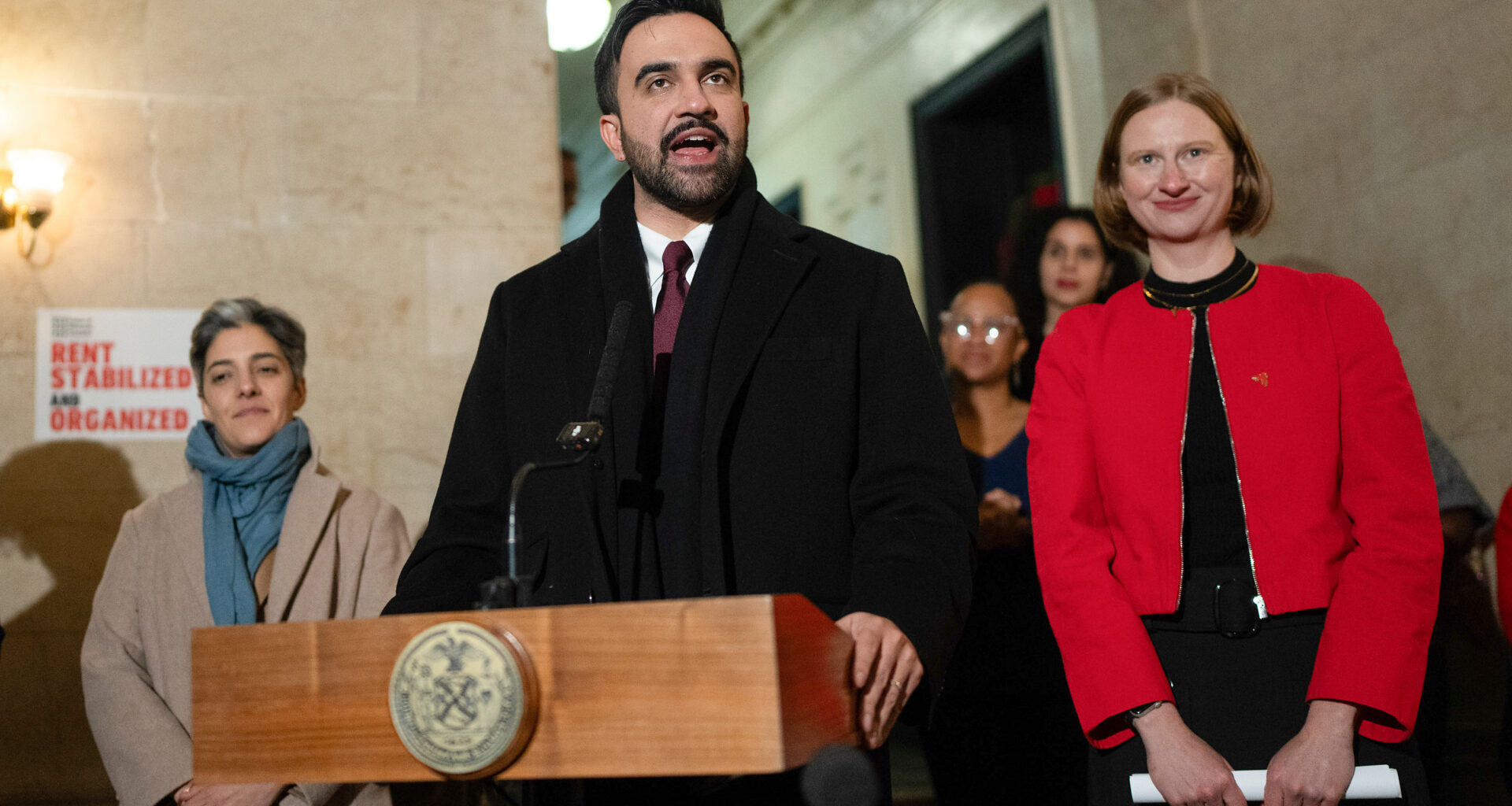 New York Mayor Zohran Mamdani, center, speaks during a news conference with Cea Weaver, right, Thursday, Jan. 1, 2026, in New York. (Michael Appleton/Mayoral Photography Office via AP)