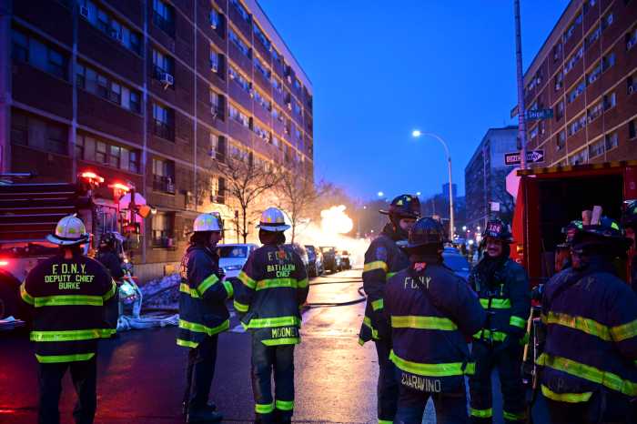 firefighters near manhole fire 