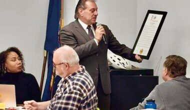 Senator Joseph P. Addabbo, Jr. presented a proclamation to Com­munity Board 6 commemorating the 120th anniversary of Forest Hills.
