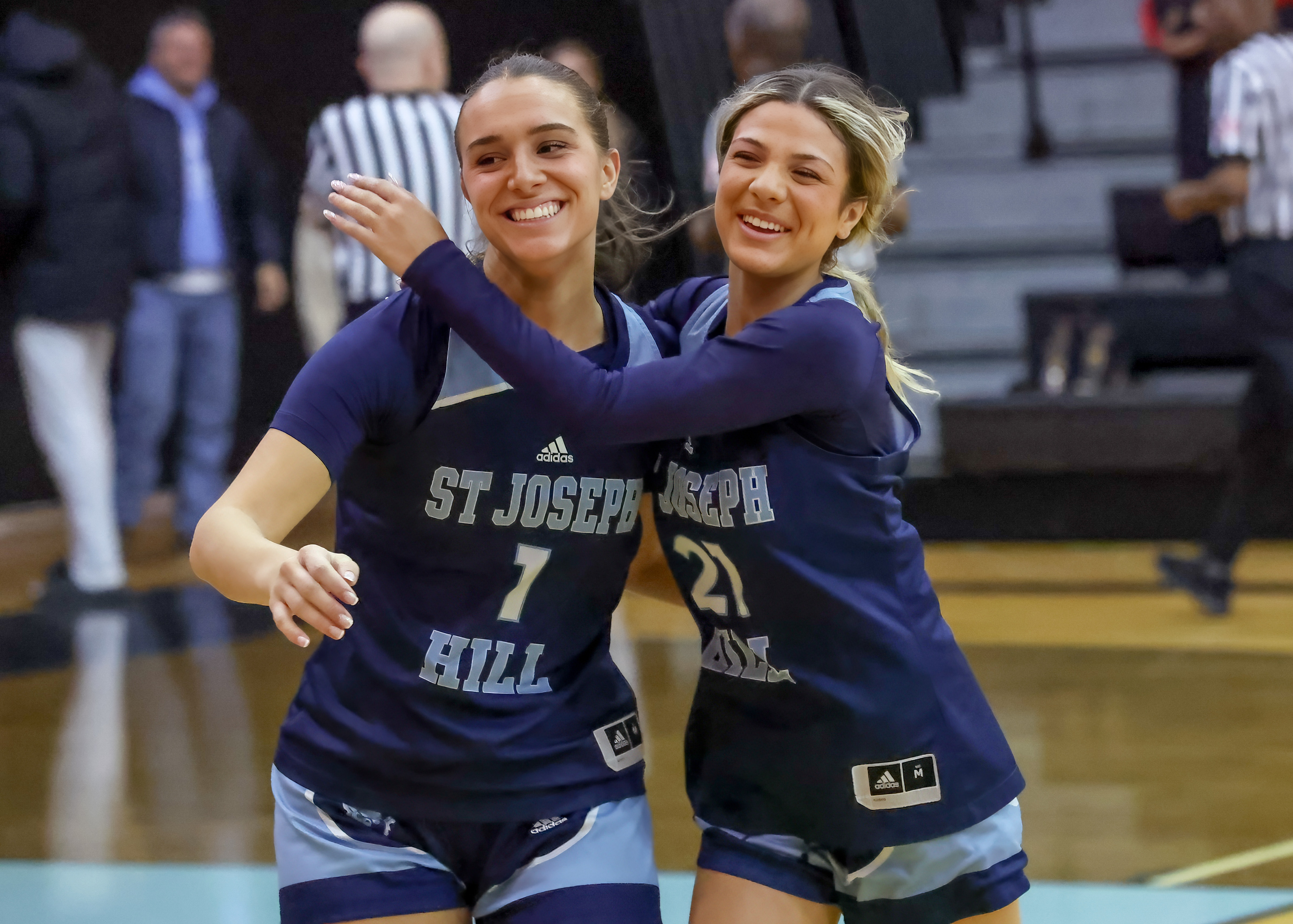St. Joseph Hill's Lauren Rodriguez embraces Ella Onesto after the Hilltoppers top Notre Dame Academy in the CHSAA Archdioscesan AA playoff semifinal at the College of Staten Island in Willowbrook on Thursday, Feb. 19, 2026. (Advance/SILive.com | Jason Paderon)