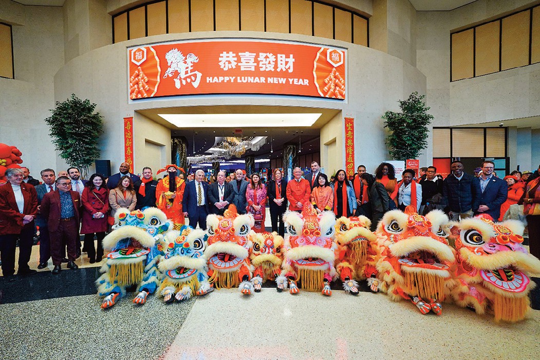 Resorts World New York City leadership, team members, and commu­nity partners gather in the Grand Lobby to cele­brate Lunar New Year and welcome the Year of the Horse.