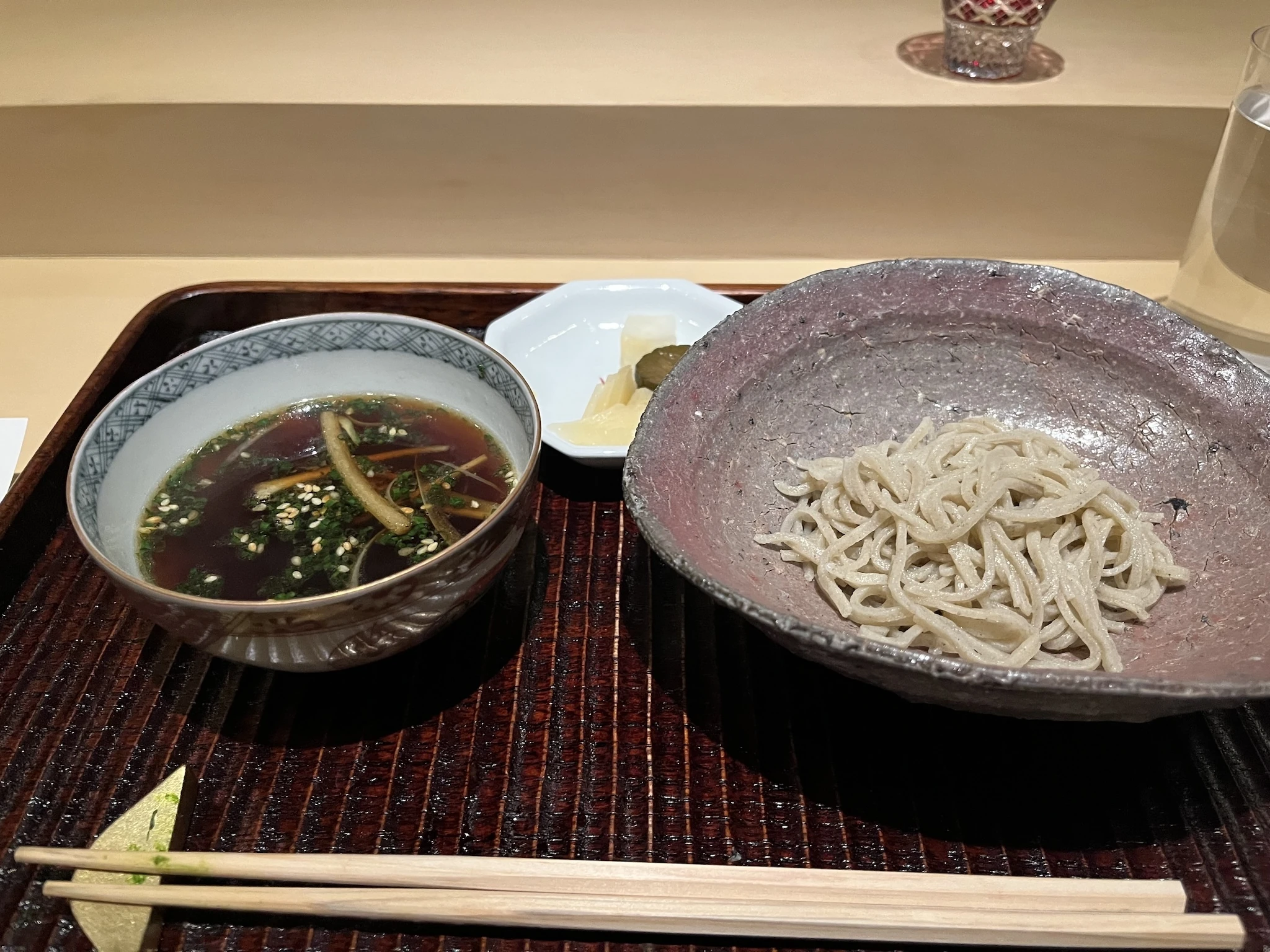 A bowl of soba noodles and broth