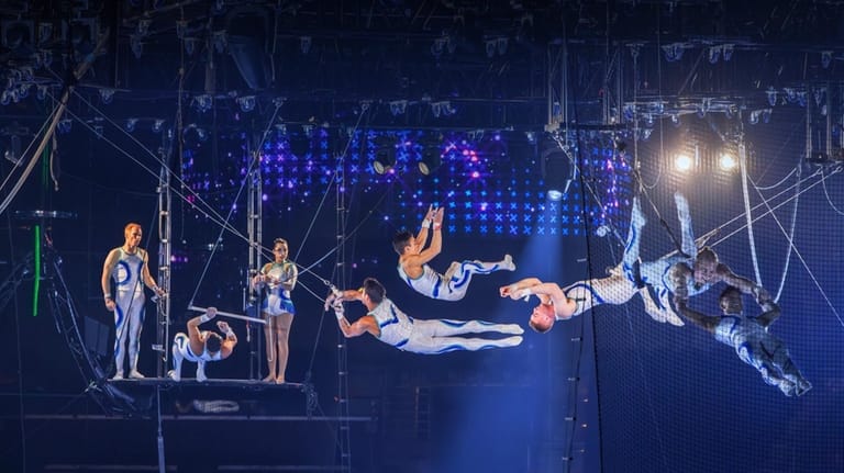Aerialists perform stunts about 25 feet above ground.