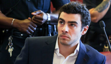 FILE - Luigi Mangione appears in Manhattan Criminal Court for an evidence hearing, Dec. 18, 2025, i...