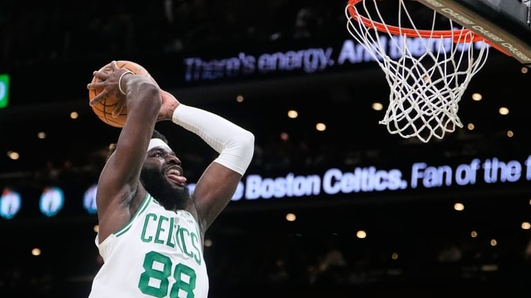 Boston Celtics center Neemias Queta (88) lines up a dunk...