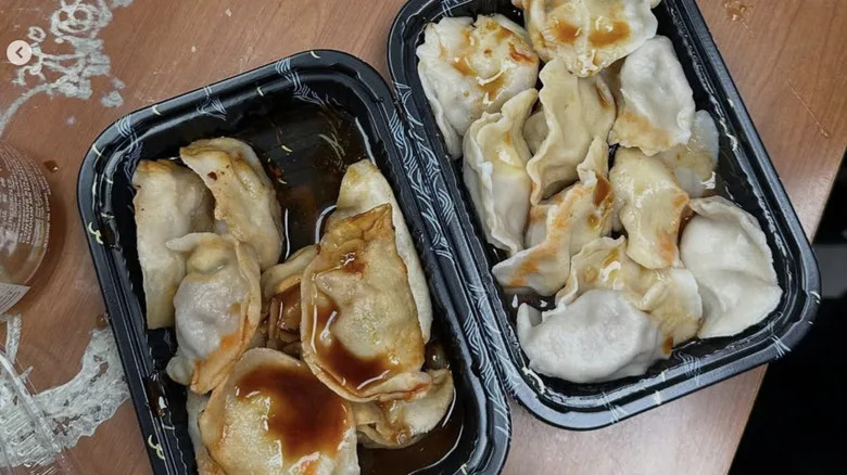 A plate of dumplings served in a plastic tray at North Dumpling