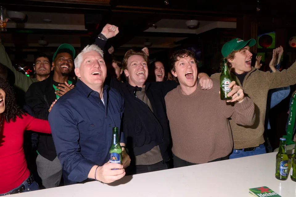 Three people looking close during the Heineken Fans Have More Friends NYC Event. (Photo: Weston Kloefkorn) <p>Photo&colon; Weston Kloefkorn</p>