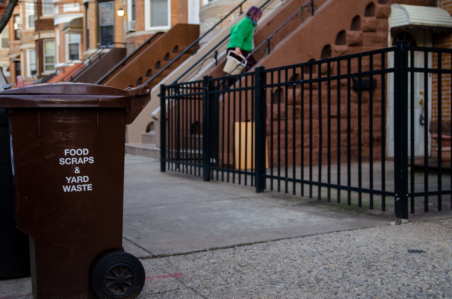 A compost bin sits outside a building in Queens, New York City. Credit: Jake Bolster/Inside Climate News