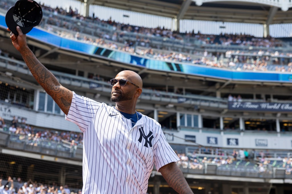 Yankees CC Sabathia salutes fans as he walks out to the field for introductions during Old Timerâs Day before a game against the Colorado Rockies, Saturday, Aug. 24, 2024, in Bronx, NY. 