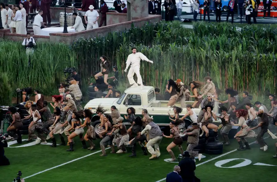 bad bunny on top of a white truck