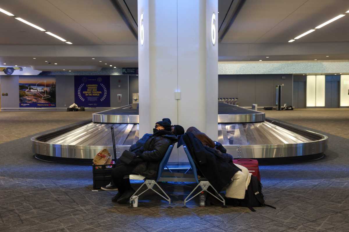 travelers at LaGuardia Airport during Nyc blizzard