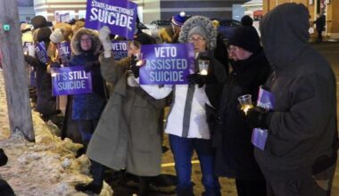 Disabilities advocates in Buffalo, New York, hold a candlelight vigil in opposition to assisted suicide.