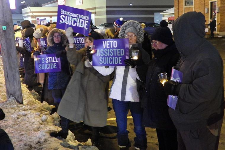 Disabilities advocates in Buffalo, New York, hold a candlelight vigil in opposition to assisted suicide.