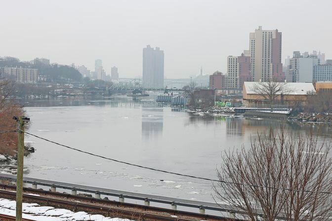 The Harlem River is a nine-mile tidal strait that separates Manhattan from the Bronx.