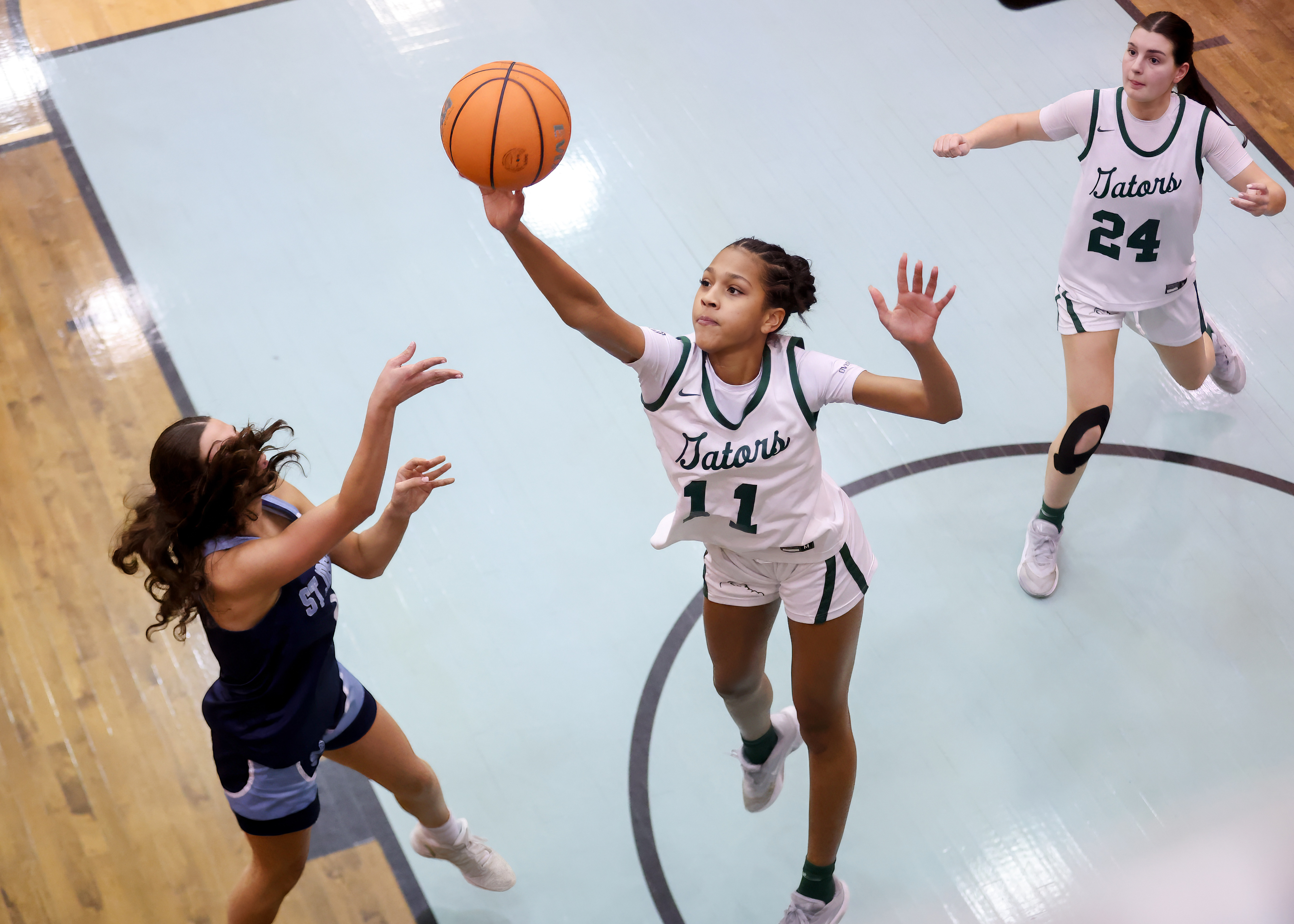 Notre Dame Academy's Gianna Lorenzo hoists up a long range jumper against St. Joseph Hill in the CHSAA Archdioscesan AA playoff semifinal at the College of Staten Island in Willowbrook on Thursday, Feb. 19, 2026. (Advance/SILive.com | Jason Paderon)