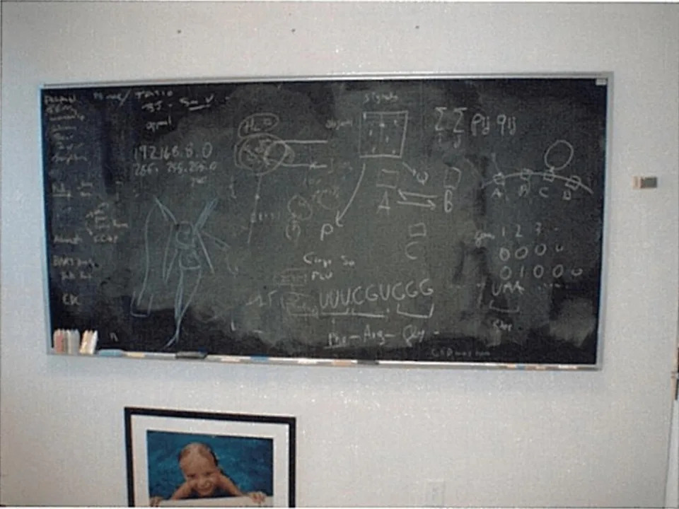 Photos obtained by the officials show a chalkboard within a unit and a photo of a young child. DOJ