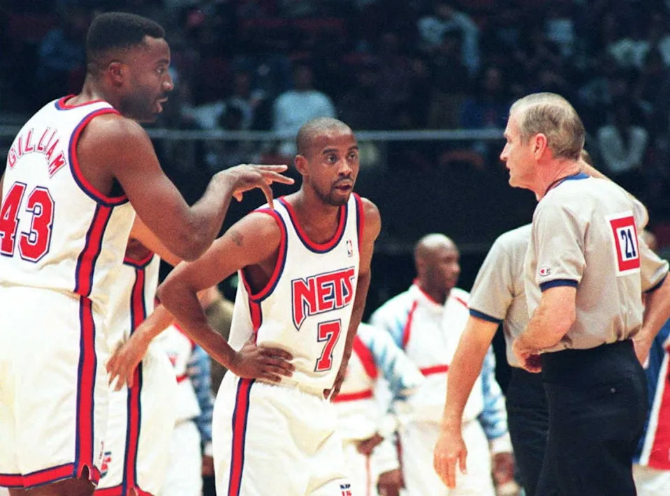 EAST RUTHERFORD, NJ - DECEMBER 12: New Jersey Nets Armon Gilliam (L) and Kenny Anderson (C) argue with NBA official Bill Oakes during first half action 12 December. The Magic defeated the Nets 101-97 as the officials made their return from the lockout. AFP PHOTO (Photo credit should read MARK PHILLIPS/AFP via Getty Images)