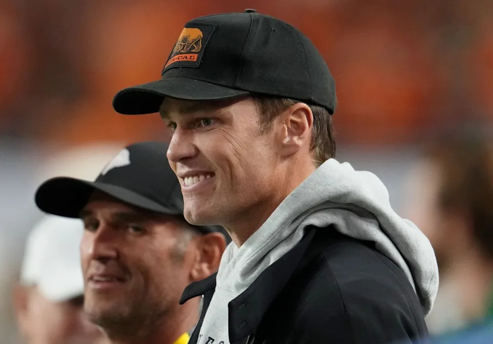 Tom Brady looks on from the sideline at Hard Rock Stadium.Kirby Lee-Imagn Images