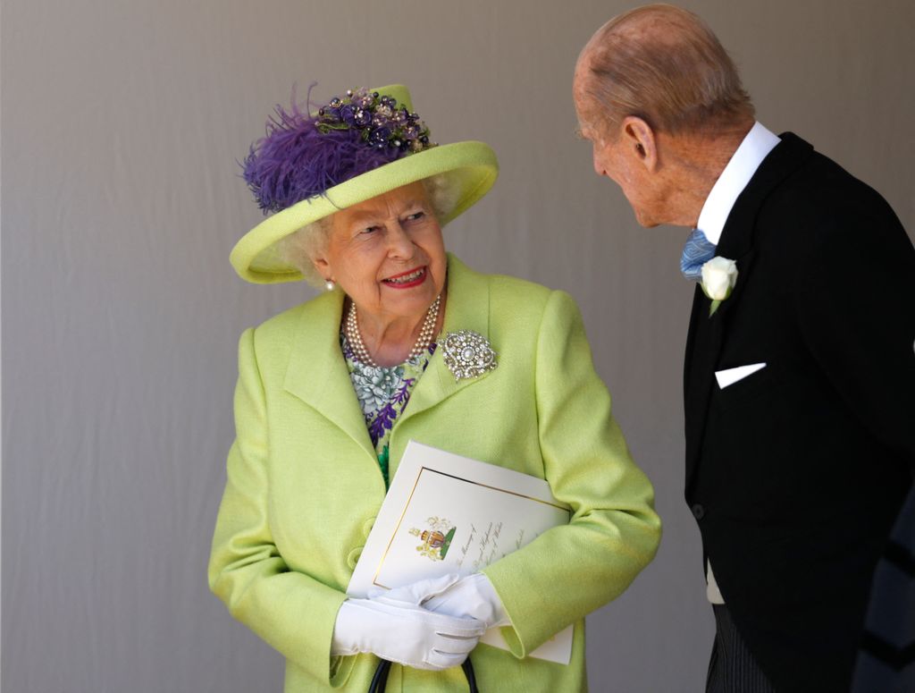 Queen Elizabeth II talking with Prince Philip 
