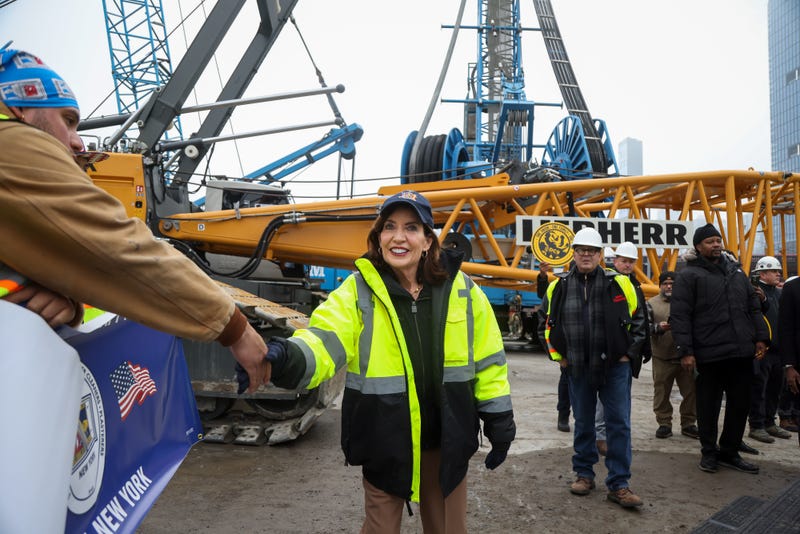 Hochul, center, greets workers at the Gateway construction site in New York on Tuesday.