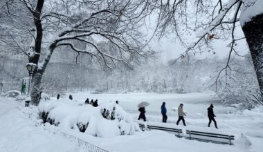 Pedestrians walk through snow in Central Park during a winter storm in New York on Feb. 23.