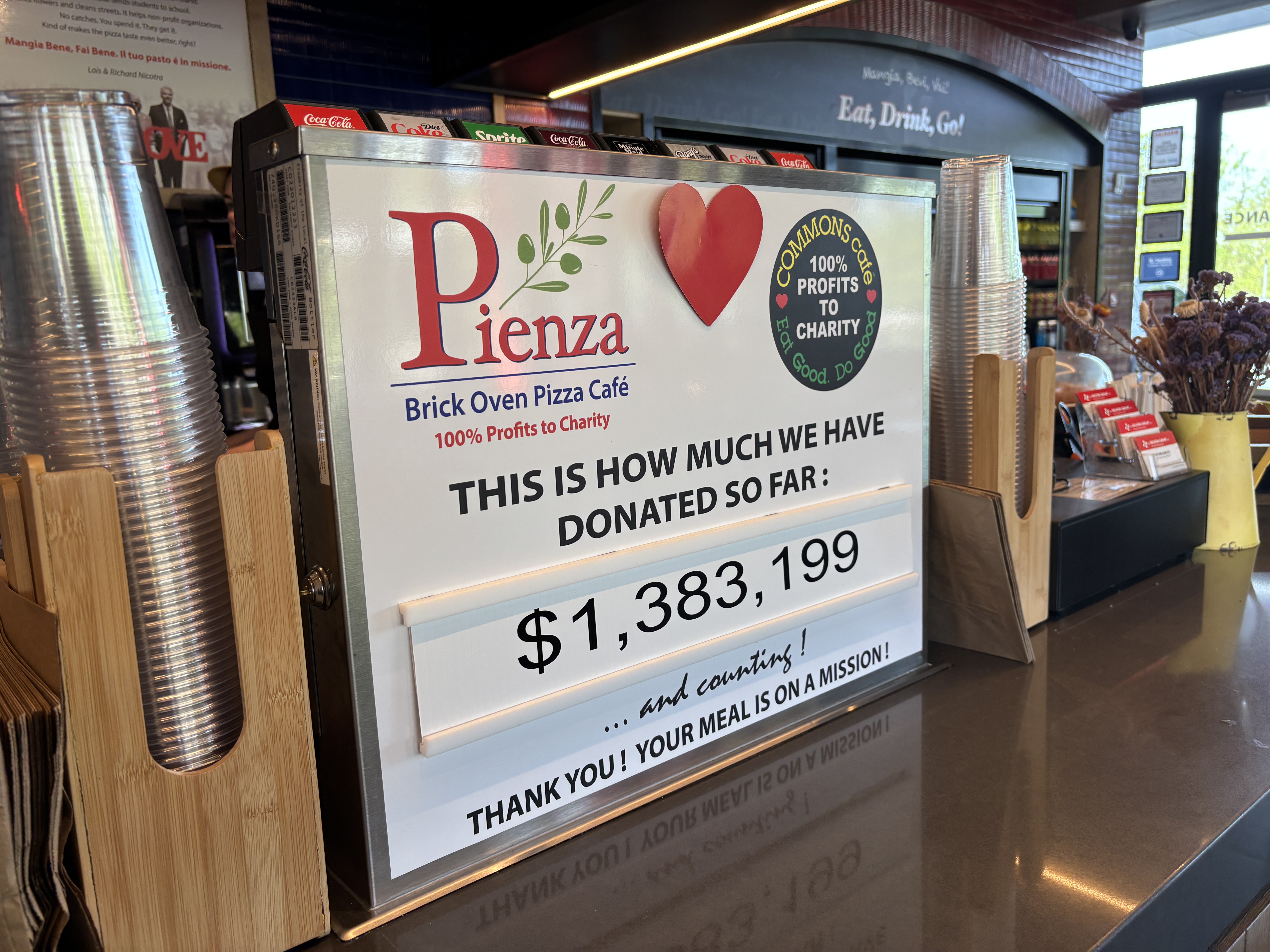 Pienza Brick Oven Pizza Café is the Nicotras’ social‑enterprise eatery inside Corporate Commons Three, where 100% of profits are donated to Staten Island charities. There’s no traditional dining room here—instead, Pienza fuels the building’s workers and visitors while quietly powering scholarships, food programs, and community grants. It’s a business model built on the idea that everyday meals can generate extraordinary impact, turning a café into a steady engine of giving.