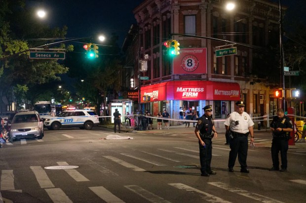 The NYPD Highway Patrol investigates after a pedestrian was fatally struck by a car on Myrtle and Seneca Aves. in Queens on Sunday, Aug. 14, 2022.