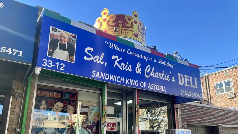 The bright blue storefront of Sal, Kris and Charlie's Deli in Astoria.
