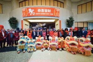 Resorts World New York City leadership, team members, and commu­nity partners gather in the Grand Lobby to cele­brate Lunar New Year and welcome the Year of the Horse.