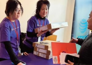 QPL Learning Support Specialist Pingping Du (left, glasses) and QPL Outreach and Partnership Special­ist EnMei Chen provided training on computer usage.