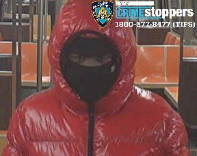 Robber in red: Cops seek bundled-up bandit who slashed man in Brooklyn subway for his wallet