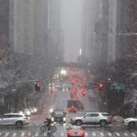 Pedestrians and cars move along 42nd Street in the Manhattan borough of New York City | News